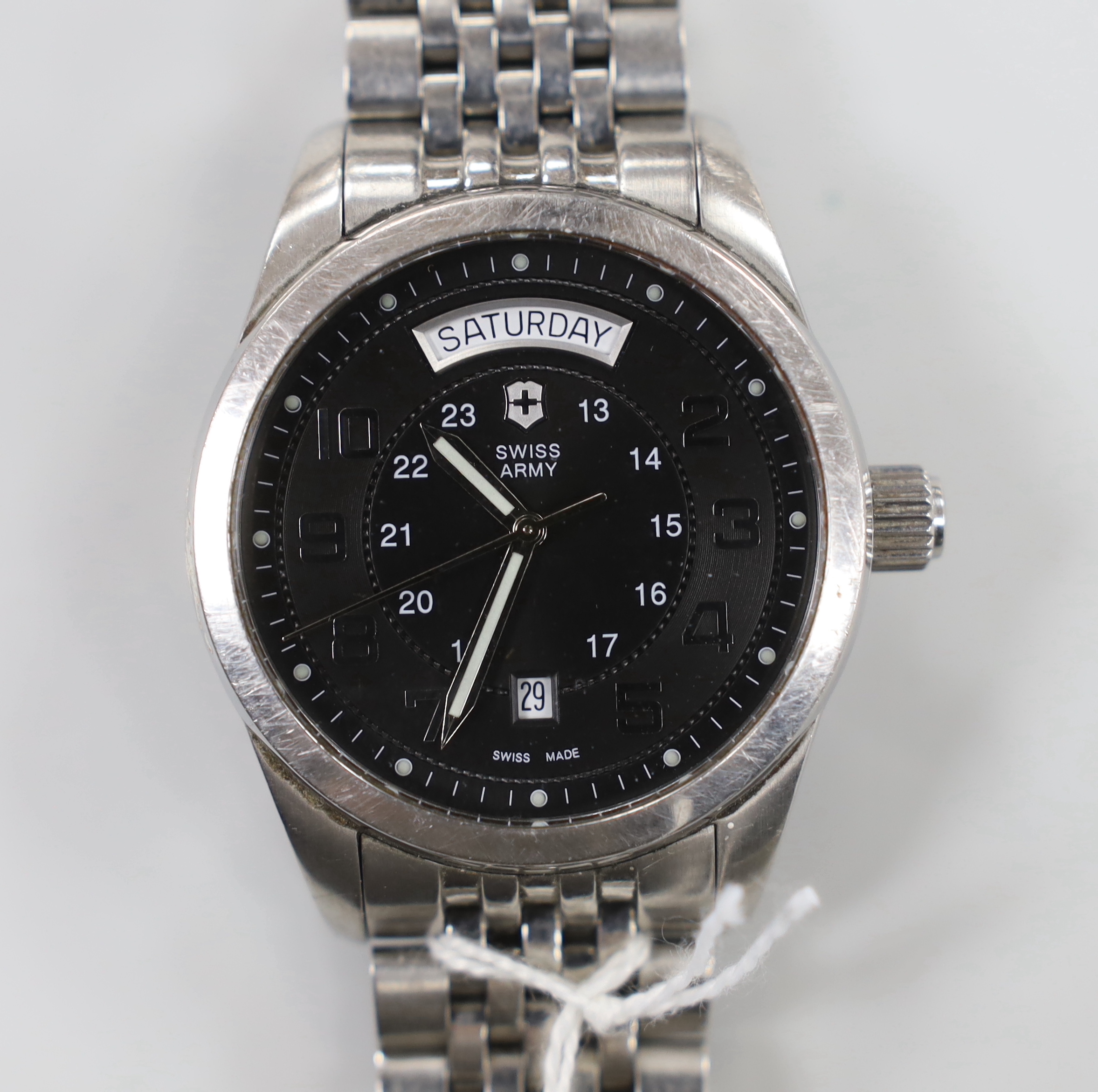 A gentleman's modern stainless steel Swiss Army day/date automatic wrist watch, on a stainless steel bracelet, no box or papers.